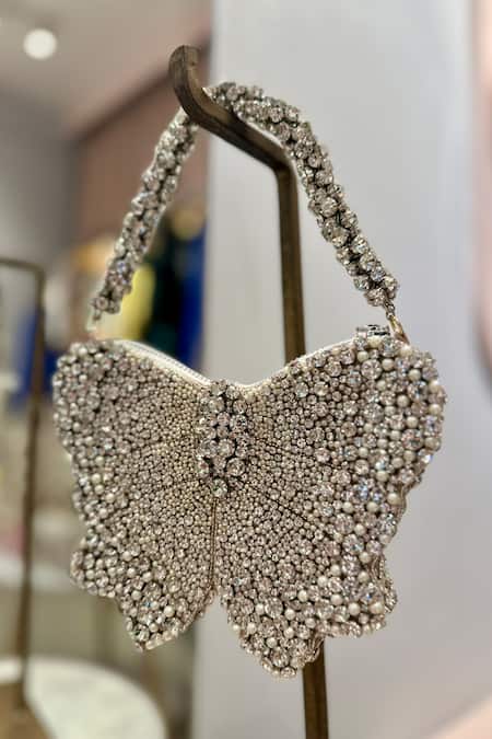 Ozel Silver Rhinestone Bow Embellished Bag Online at Aza Fashions Ozel_Silver Rhinestone Bow Embellished Bag _Online_at_Aza_Fashions