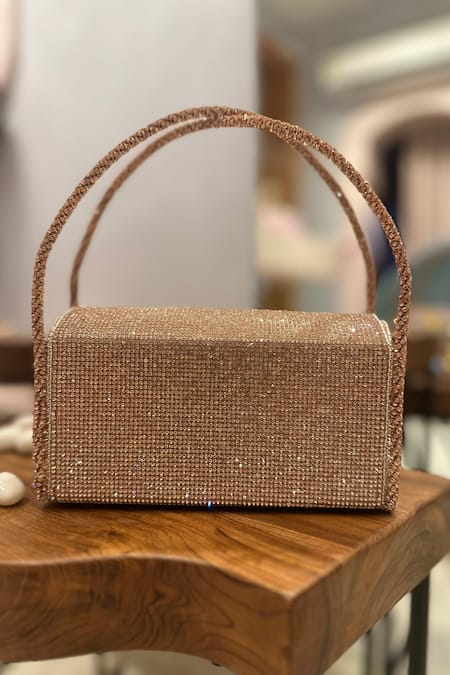 Shop Ozel Rose Gold Crystal Bow Embellished Flap Bag Online at Aza Fashions Shop_Ozel_Rose Gold Crystal Bow Embellished Flap Bag _Online_at_Aza_Fashions