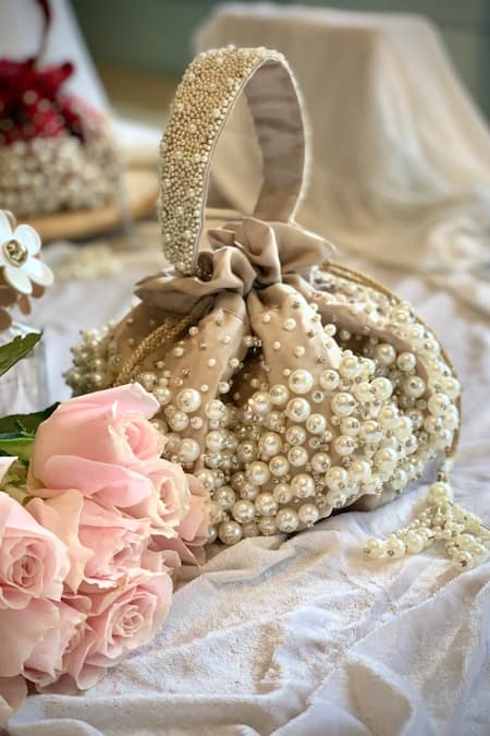 Shop Ozel Beige Pearls Bijoux Moti Embellished Potli Bag at Aza Fashions Shop_Ozel_Beige Pearls Bijoux Moti Embellished Potli Bag _at_Aza_Fashions