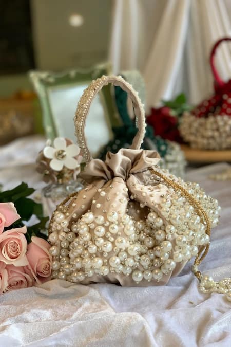 Ozel Beige Pearls Bijoux Moti Embellished Potli Bag Online at Aza Fashions Ozel_Beige Pearls Bijoux Moti Embellished Potli Bag _Online_at_Aza_Fashions