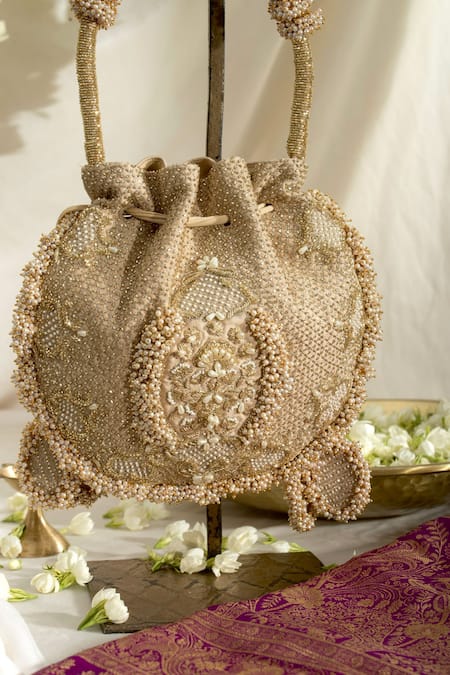 Ozel_Gold Cut Work, Pearls, Sequins Suhani Moti Meadow Embellished Potli Bag _Online_at_Aza_Fashions