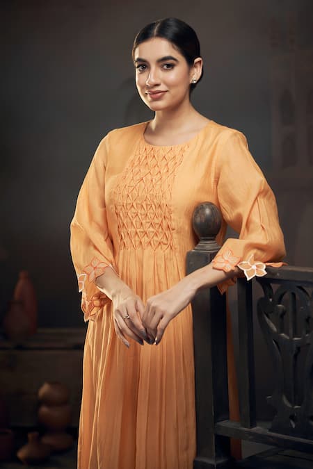 Shop Hirika & Dhruti Yellow Chanderi Embroidery Round Neck Smocked Gathered Kurta With Pant at Aza Fashions Shop_Hirika & Dhruti_Yellow Chanderi Embroidery Round Neck Smocked Gathered Kurta With Pant _at_Aza_Fashions