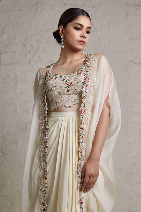 Shop Prisho Ivory Silk, Organza, Crepe Embroidery, Zari Round Border Cape Draped Skirt Set at Aza Fashions Shop_Prisho_Ivory Silk, Organza, Crepe Embroidery, Zari Round Border Cape Draped Skirt Set _at_Aza_Fashions