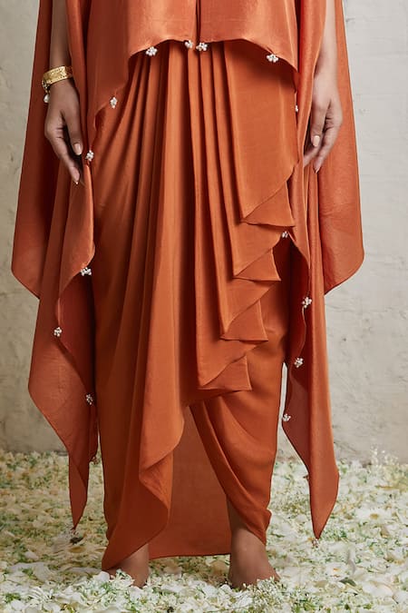 Prisho Orange Silk, Crepe Diamonds, Embroidery Neckline Kaftan And Dhoti Skirt Set Online at Aza Fashions Prisho_Orange Silk, Crepe Diamonds, Embroidery Neckline Kaftan And Dhoti Skirt Set _Online_at_Aza_Fashions