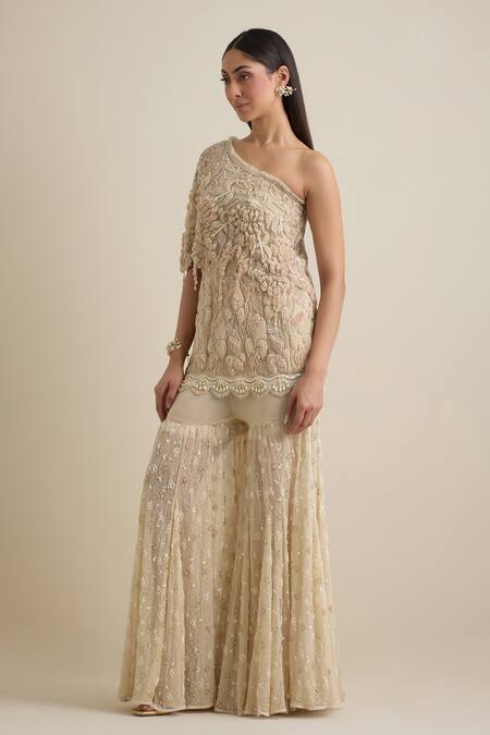 Buy Eeksha Beige Lace, Lycra, Net Pearls, Sequins One Shoulder Embroidered Cape Sharara Set Buy_Eeksha_Beige Lace, Lycra, Net Pearls, Sequins One Shoulder Embroidered Cape Sharara Set
