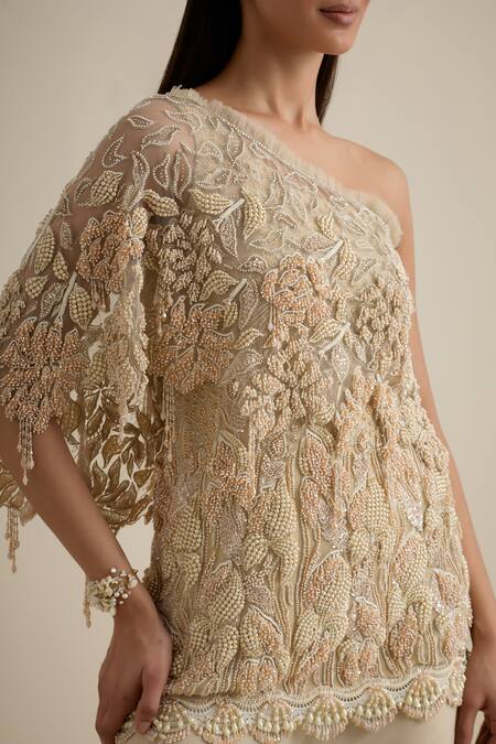 Shop Eeksha Beige Lace, Lycra, Net Pearls, Sequins One Shoulder Embroidered Cape Sharara Set Shop_Eeksha_Beige Lace, Lycra, Net Pearls, Sequins One Shoulder Embroidered Cape Sharara Set