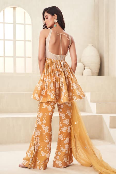 Shop Taavare Gold Organza, Tulle Embroidery Square Floral Print Peplum Top And Flared Pant Set at Aza Fashions Shop_Taavare_Gold Organza, Tulle Embroidery Square Floral Print Peplum Top And Flared Pant Set _at_Aza_Fashions