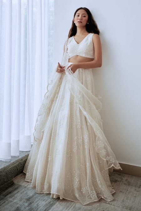 Shop Lavanya Ahuja Ivory Crepe, Organza Sequins, Beads V-neck Hand Embroidered Blouse Lehenga Set at Aza Fashions Shop_Lavanya Ahuja_Ivory Crepe, Organza Sequins, Beads V-neck Hand Embroidered Blouse Lehenga Set _at_Aza_Fashions