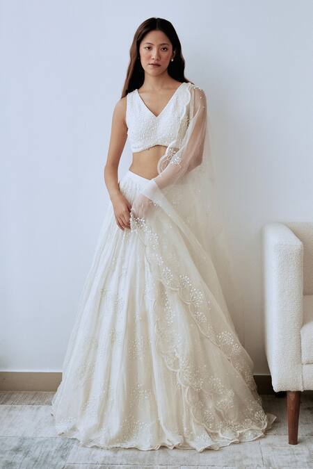 Buy Lavanya Ahuja Ivory Crepe, Organza Sequins, Beads V-neck Hand Embroidered Blouse Lehenga Set Online at Aza Fashions Buy_Lavanya Ahuja_Ivory Crepe, Organza Sequins, Beads V-neck Hand Embroidered Blouse Lehenga Set _Online_at_Aza_Fashions