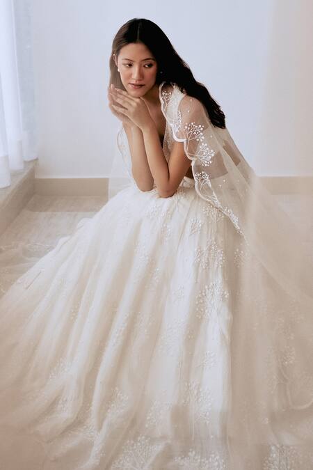 Lavanya Ahuja Ivory Crepe, Organza Sequins, Beads V-neck Hand Embroidered Blouse Lehenga Set at Aza Fashions Lavanya Ahuja_Ivory Crepe, Organza Sequins, Beads V-neck Hand Embroidered Blouse Lehenga Set _at_Aza_Fashions