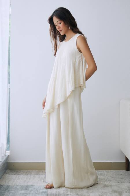 Shop Lavanya Ahuja Ivory Crepe Sequins, Beads Round Neck Embroidered Asymmetrical Tunic And Pant Set at Aza Fashions Shop_Lavanya Ahuja_Ivory Crepe Sequins, Beads Round Neck Embroidered Asymmetrical Tunic And Pant Set _at_Aza_Fashions