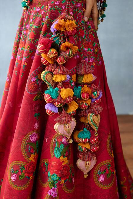 Shop_Torani_Red Jersey, Silk Fringe, Tassels, Pom-poms Blouse And Floral Print Lehenga Set _Online_at_Aza_Fashions