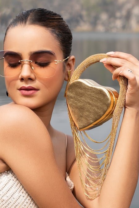 Shop Modarta Gold Crystals Heart Shaped Clutch Online at Aza Fashions Shop_Modarta_Gold Crystals Heart Shaped Clutch _Online_at_Aza_Fashions