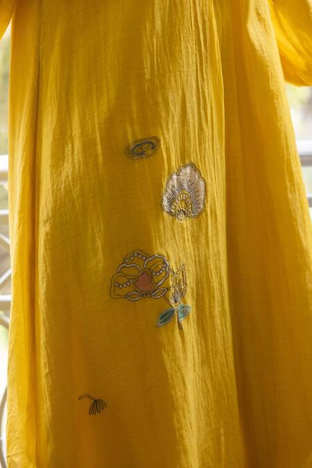 Shop Vaayu Yellow Muslin, Cotton Embroidery, Applique V-neck Rue Floral Dress Online at Aza Fashions Shop_Vaayu_Yellow Muslin, Cotton Embroidery, Applique V-neck Rue Floral Dress_Online_at_Aza_Fashions