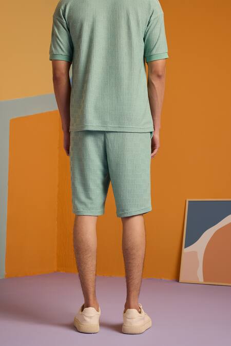 Shop Muvazo Green Cotton, Polyester Maverick Jacquard Knee Length Shorts at Aza Fashions Shop_Muvazo_Green Cotton, Polyester Maverick Jacquard Knee Length Shorts _at_Aza_Fashions