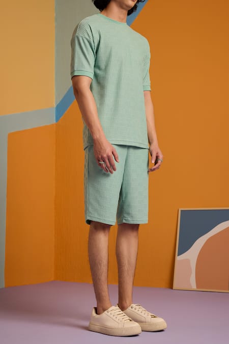 Muvazo Green Cotton, Polyester Maverick Jacquard Knee Length Shorts at Aza Fashions Muvazo_Green Cotton, Polyester Maverick Jacquard Knee Length Shorts _at_Aza_Fashions