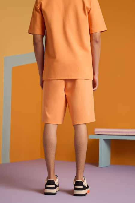 Shop Muvazo Orange Cotton, Polyester Abstract Sunbeam Print Shorts at Aza Fashions Shop_Muvazo_Orange Cotton, Polyester Abstract Sunbeam Print Shorts _at_Aza_Fashions