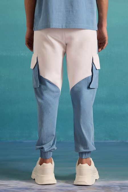 Shop Muvazo Blue Cotton, Polyester Coastal Mist Colorblock Joggers at Aza Fashions Shop_Muvazo_Blue Cotton, Polyester Coastal Mist Colorblock Joggers _at_Aza_Fashions