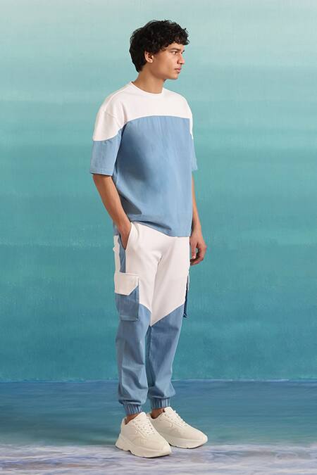 Muvazo Blue Cotton, Polyester Coastal Mist Colorblock Joggers at Aza Fashions Muvazo_Blue Cotton, Polyester Coastal Mist Colorblock Joggers _at_Aza_Fashions