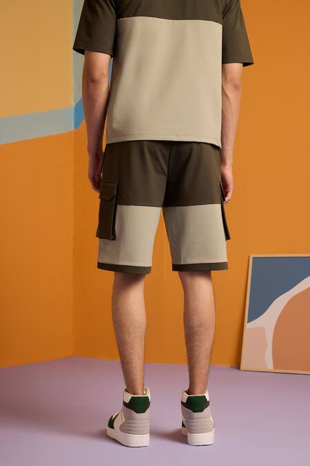 Shop Muvazo Green Cotton, Polyester Chromatic Crazee Shorts at Aza Fashions Shop_Muvazo_Green Cotton, Polyester Chromatic Crazee Shorts _at_Aza_Fashions