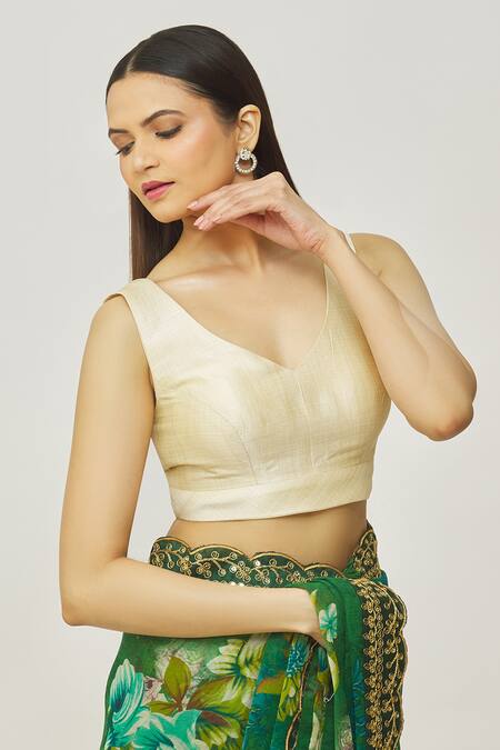 Shop_Naintara Bajaj_Gold Muslin Plunge Neck Metallic Solid Blouse _Online_at_Aza_Fashions