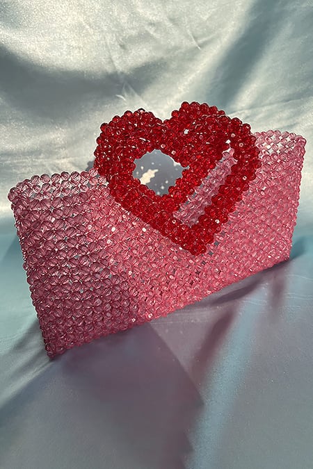 Buy_Rubilon_Pink Acrylic Crystal Woven Handbag With Heart Handle _Online_at_Aza_Fashions
