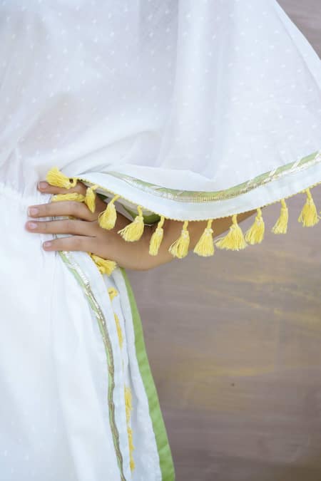 Nero India Ivory Cotton Tassels V-neck Gota Lace Embellished Kaftan Tunic And Pant Set Online at Aza Fashions Nero India_Ivory Cotton Tassels V-neck Gota Lace Embellished Kaftan Tunic And Pant Set _Online_at_Aza_Fashions