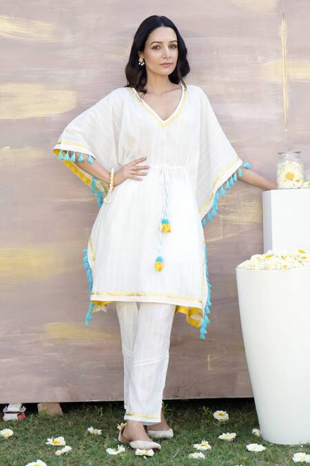 Nero India Ivory Cotton Tassels, Gota Patti Lace Embellished Kaftan Tunic And Pant Set Online at Aza Fashions Nero India_Ivory Cotton Tassels, Gota Patti Lace Embellished Kaftan Tunic And Pant Set _Online_at_Aza_Fashions