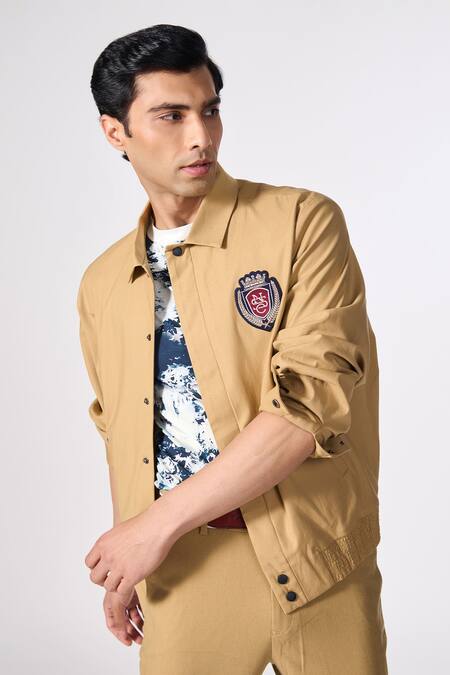 Shop_S&N By Shantnu Nikhil_Beige Lycra, Terrycloth Embroidery Placed Crest Jacket_Online_at_Aza_Fashions