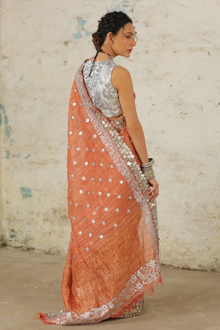 Shop Saksham & Neharicka Orange Tussar Applique Copper Embroidered Saree With Unstitched Blouse Piece at Aza Fashions Shop_Saksham & Neharicka_Orange Tussar Applique Copper Embroidered Saree With Unstitched Blouse Piece _at_Aza_Fashions