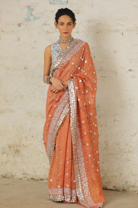 Shop Saksham & Neharicka Orange Tussar Applique Copper Embroidered Saree With Unstitched Blouse Piece Online at Aza Fashions Shop_Saksham & Neharicka_Orange Tussar Applique Copper Embroidered Saree With Unstitched Blouse Piece _Online_at_Aza_Fashions