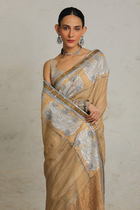 Shop Saksham & Neharicka Beige Tussar Gota Patti, Mahalaya Embroidered Saree With Unstitched Blouse Piece Online at Aza Fashions Shop_Saksham & Neharicka_Beige Tussar Gota Patti, Mahalaya Embroidered Saree With Unstitched Blouse Piece _Online_at_Aza_Fashions