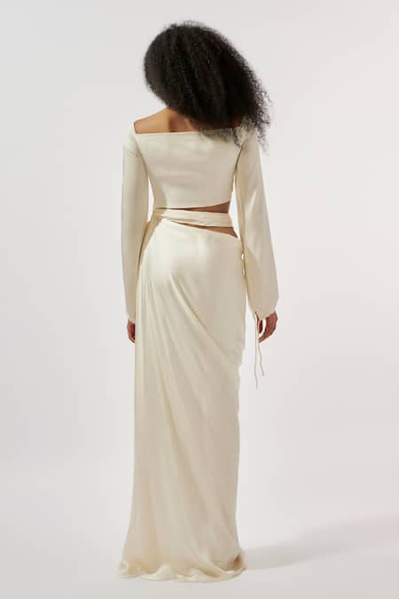 Deme By Gabriella Ivory Modal, Satin V-neck Draped Cutout Gown Online at Aza Fashions Deme By Gabriella_Ivory Modal, Satin V-neck Draped Cutout Gown _Online_at_Aza_Fashions