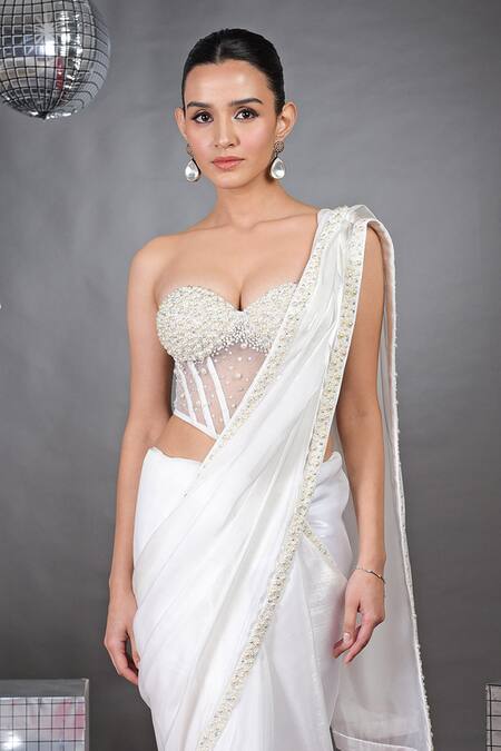 Shop Talking Threads White Organza Pearls, Beads Off-shoulder Border Embellished Saree With Corset Online at Aza Fashions Shop_Talking Threads_White Organza Pearls, Beads Off-shoulder Border Embellished Saree With Corset _Online_at_Aza_Fashions