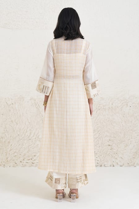 Shop Rishi and Vibhuti Ivory Chanderi, Crepe Beads, Eraya Neckline Embellished Kurta And Flared Pant Set at Aza Fashions Shop_Rishi and Vibhuti_Ivory Chanderi, Crepe Beads, Eraya Neckline Embellished Kurta And Flared Pant Set _at_Aza_Fashions