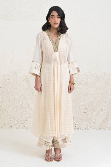 Rishi and Vibhuti Ivory Chanderi, Crepe Beads, Eraya Neckline Embellished Kurta And Flared Pant Set Online at Aza Fashions Rishi and Vibhuti_Ivory Chanderi, Crepe Beads, Eraya Neckline Embellished Kurta And Flared Pant Set _Online_at_Aza_Fashions