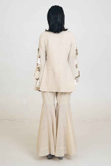 Shop Rishi and Vibhuti Ivory Linen, Jersey Embroidery Alkaline Patchwork Embellished Jacket Gharara Set at Aza Fashions Shop_Rishi and Vibhuti_Ivory Linen, Jersey Embroidery Alkaline Patchwork Embellished Jacket Gharara Set _at_Aza_Fashions
