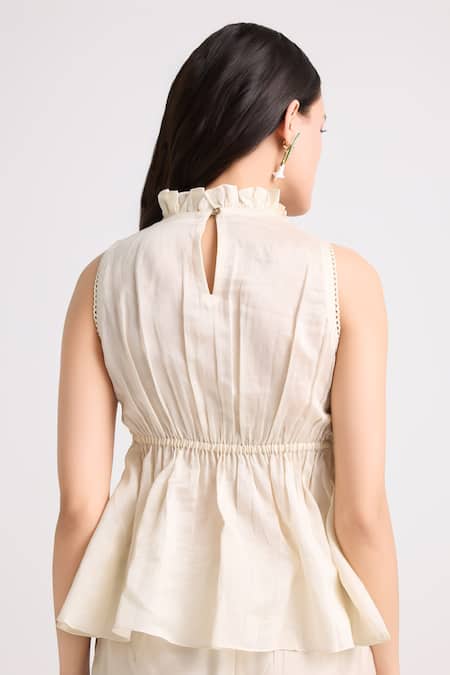 Shop Chandrima Ivory Chanderi, Cotton Racerback Smocked Bodice Peplum Top at Aza Fashions Shop_Chandrima_Ivory Chanderi, Cotton Racerback Smocked Bodice Peplum Top _at_Aza_Fashions
