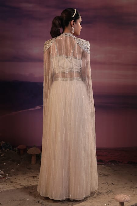 Shop COUTURE BY NIHARIKA Ivory Organza, Net Embroidery, Cut Work Sweetheart Neck Long Cape With Skirt Set at Aza Fashions Shop_COUTURE BY NIHARIKA_Ivory Organza, Net Embroidery, Cut Work Sweetheart Neck Long Cape With Skirt Set _at_Aza_Fashions