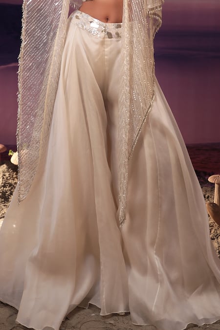 COUTURE BY NIHARIKA_Ivory Satin, Organza, Net Beads, Cut Work, Geometric Cape Flared Pant Set _Online_at_Aza_Fashions