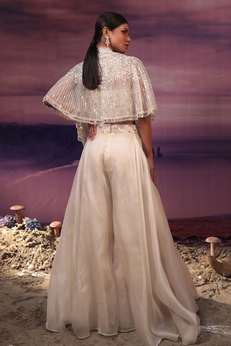 Shop_COUTURE BY NIHARIKA_Ivory Satin, Organza, Net Beads, Cut Work, Geometric Cape Flared Pant Set _at_Aza_Fashions
