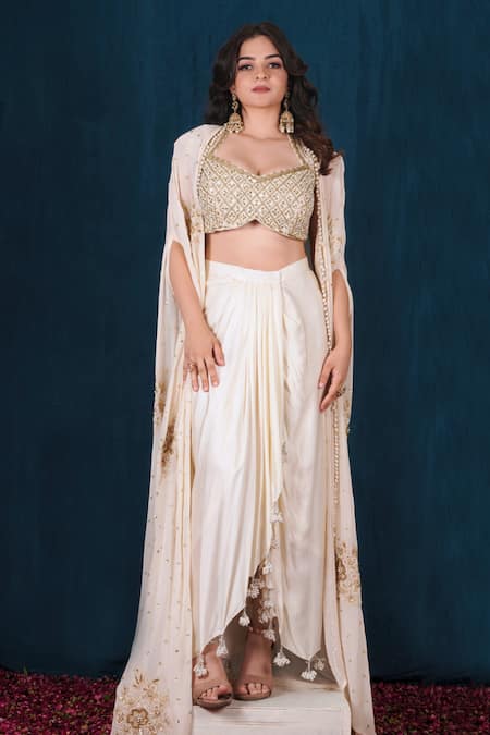 Saubhagya Off White Silk, Modal Sequins Sweetheart Neck Embroidered Cape Draped Skirt Set Online at Aza Fashions Saubhagya_Off White Silk, Modal Sequins Sweetheart Neck Embroidered Cape Draped Skirt Set _Online_at_Aza_Fashions