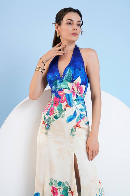 Mandira Wirk Resort_Blue Satin Halter Neck Floral Print Slit Dress _at_Aza_Fashions