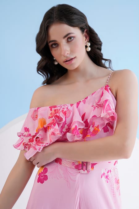 Shop_Mandira Wirk Resort_Pink Chiffon One Shoulder Orchid Print Jumpsuit _Online_at_Aza_Fashions