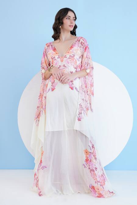 Shop Mandira Wirk Resort Ivory Chiffon Embroidery, Pearls Plunge Neck Embellished Floral Print Kaftan Online at Aza Fashions Shop_Mandira Wirk Resort_Ivory Chiffon Embroidery, Pearls Plunge Neck Embellished Floral Print Kaftan _Online_at_Aza_Fashions