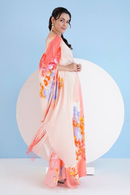 Shop Mandira Wirk Resort Peach Viscose, Crepe Fringe Asymmetric Damsel Floral Print Kaftan Online at Aza Fashions Shop_Mandira Wirk Resort_Peach Viscose, Crepe Fringe Asymmetric Damsel Floral Print Kaftan _Online_at_Aza_Fashions
