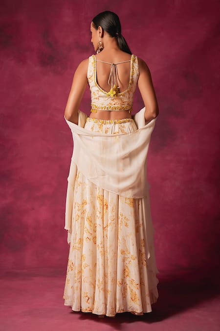 Shop Saundh Off White Crepe Crystals Round Neck Cornelia Foliage Print Cape Lehenga Set at Aza Fashions Shop_Saundh_Off White Crepe Crystals Round Neck Cornelia Foliage Print Cape Lehenga Set_at_Aza_Fashions