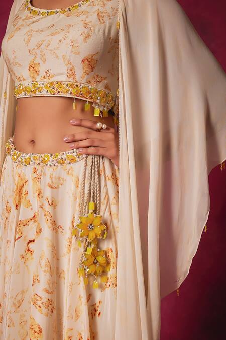 Shop Saundh Off White Crepe Crystals Round Neck Cornelia Foliage Print Cape Lehenga Set Shop_Saundh_Off White Crepe Crystals Round Neck Cornelia Foliage Print Cape Lehenga Set
