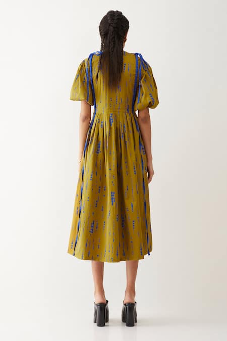 Shop Son Of A Noble Snob Gold Cotton Satin Bows Round Neck Sira Blot Print Dress at Aza Fashions Shop_Son Of A Noble Snob_Gold Cotton Satin Bows Round Neck Sira Blot Print Dress _at_Aza_Fashions