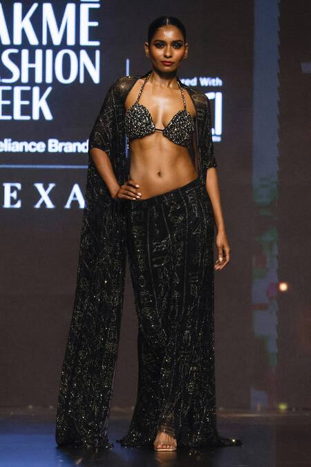 Shop Itrh Black Net Crystals Halter Neck Desert Mirage Embellished Cape Skirt Set at Aza Fashions Shop_Itrh_Black Net Crystals Halter Neck Desert Mirage Embellished Cape Skirt Set_at_Aza_Fashions